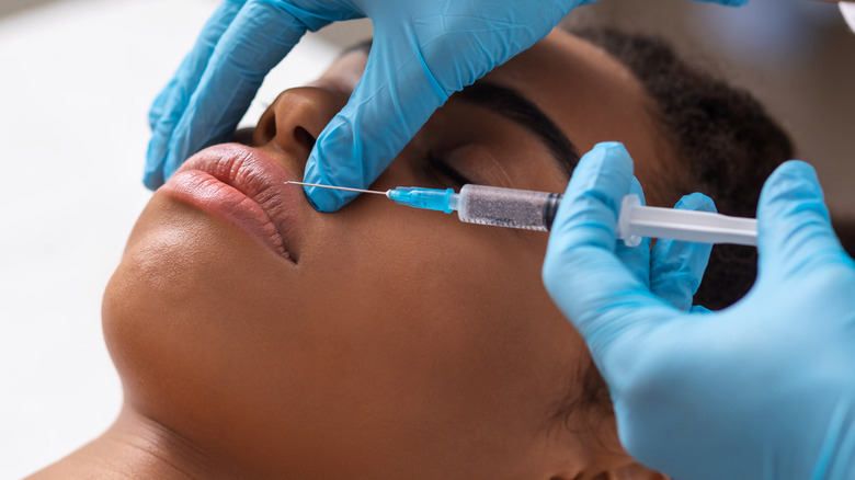 woman getting lip fillers