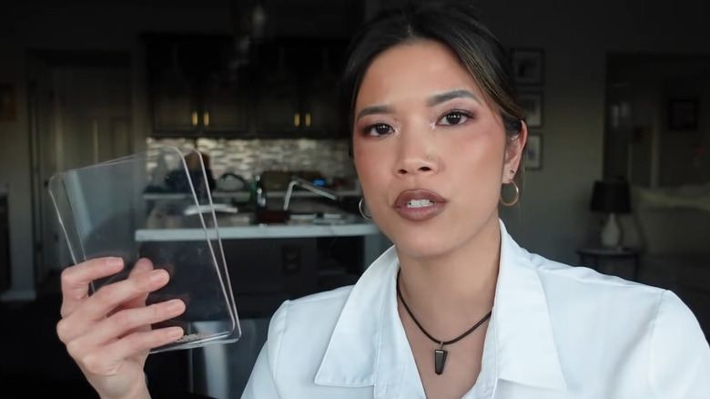 Makeup artist holding an acrylic palette