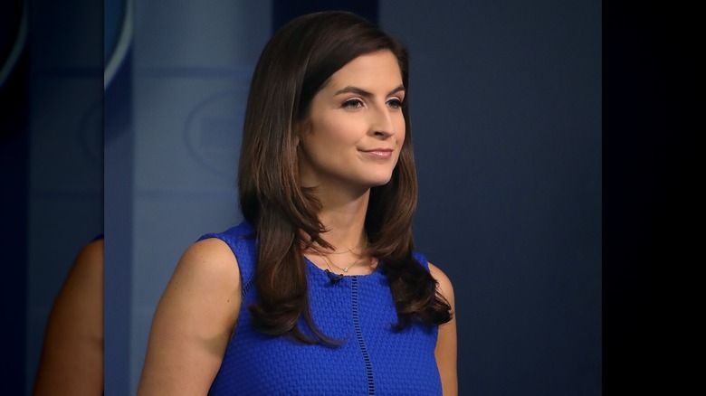 Kaitlan Collins with long straight hair and flippy ends