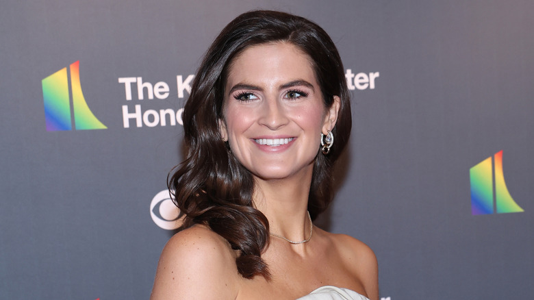 Kaitlan Collins with barrel curls and a side part