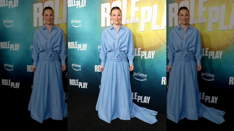 Kaley Cuoco smiles in a blue dress