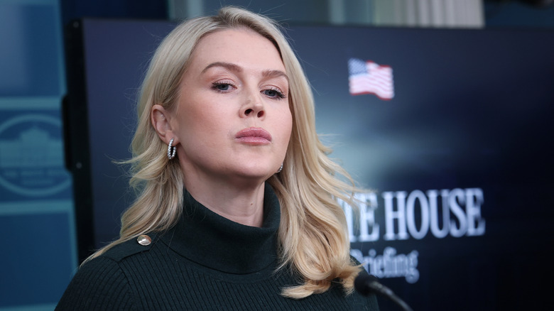 A closeup of Karoline Leavitt in the press room