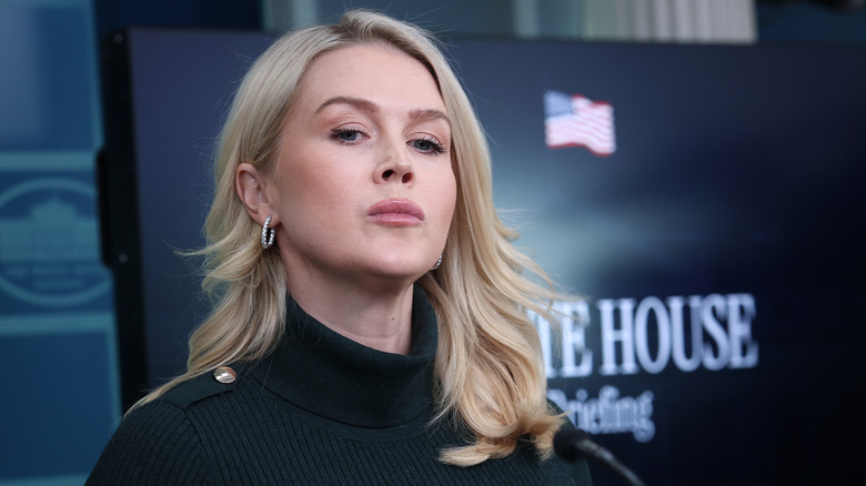 A closeup of Karoline Leavitt in the press room