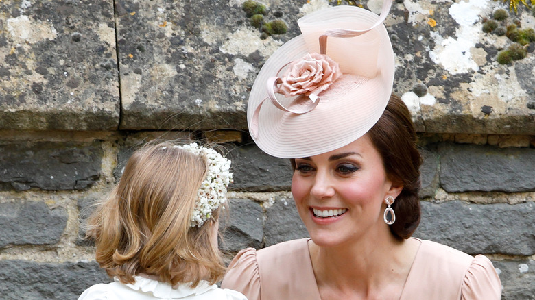 Kate Middleton smiling at Princess Charlotte during Pippa's wedding
