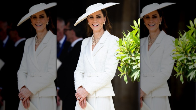 Kate Middleton wearing a white jacket and skirt