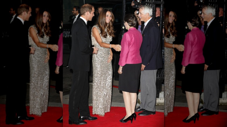 Kate Middleton smiles wearing a floor-length silver sequin gown next to Prince William