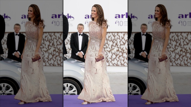 Kate Middleton wearing a blush pink embellished gown with flowy sleeves