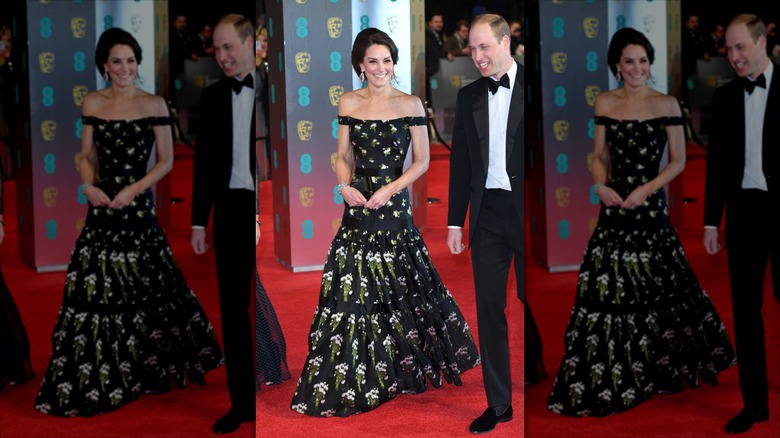 Kate Middleton smiles wearing a three-tier floral gown next to Prince William