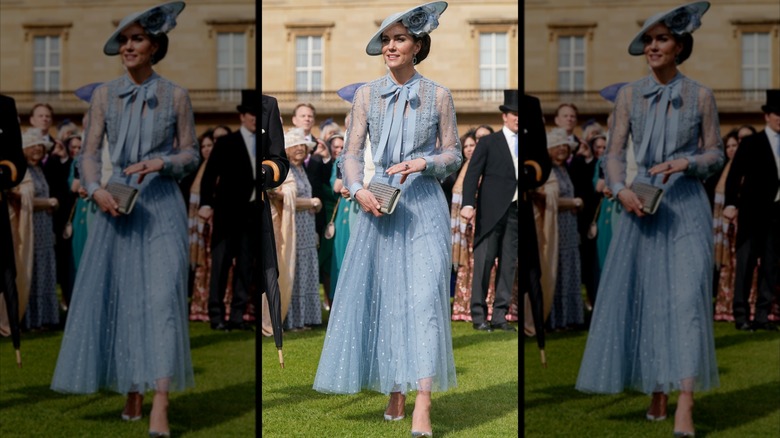 Kate Middleton wearing a dusty-blue dress with sheer sleeves and matching hat at King Charles' Coronation Garden Party.