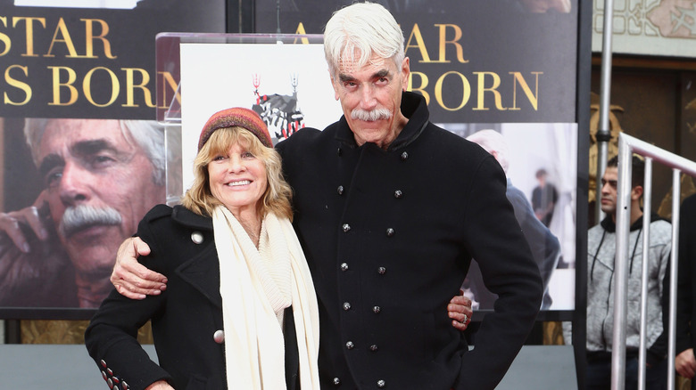 Sam Elliott with his hand on Katharine Ross's shoulder at the Sam Elliott Hand And Footprint Ceremony