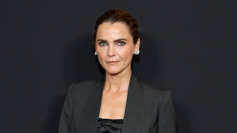 Keri Russell smiles in a black blazer