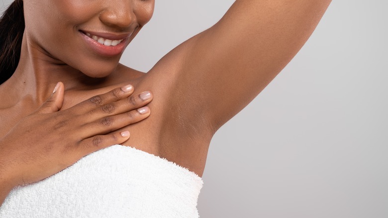 Woman with hairless underarms 