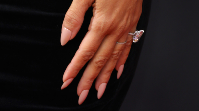 Kim Kardashian hand pink nails
