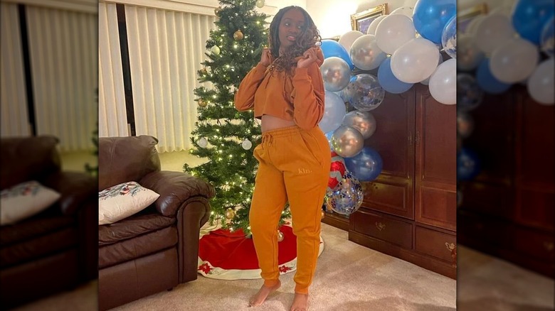 Woman wearing KIN Apparel jogging suit