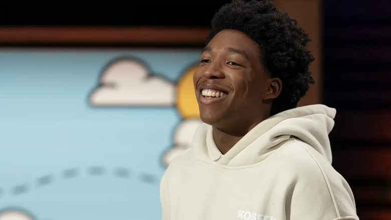 Close-up of Kobe Harris in a beige hoodie