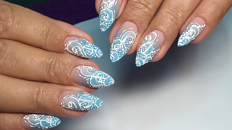 Blue and white lace nails manicure