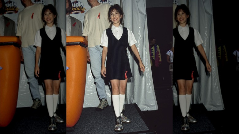 Lacey Chabert stands and smiles at the 1996 Kids Choice Awards