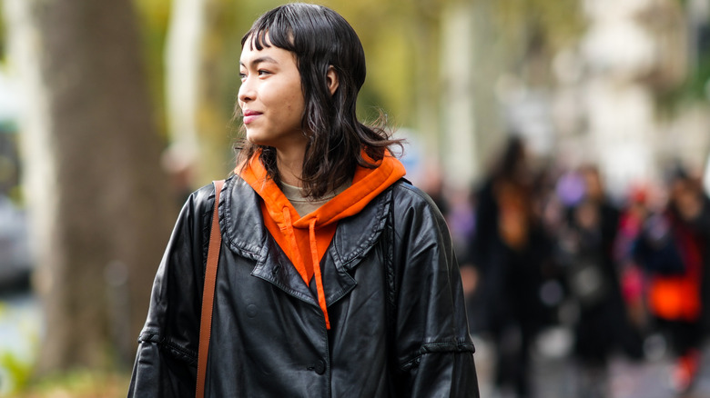 Woman in leather trench coat