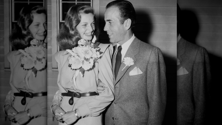 Lauren Bacall and Humphrey Bogart smile at each other on their wedding day