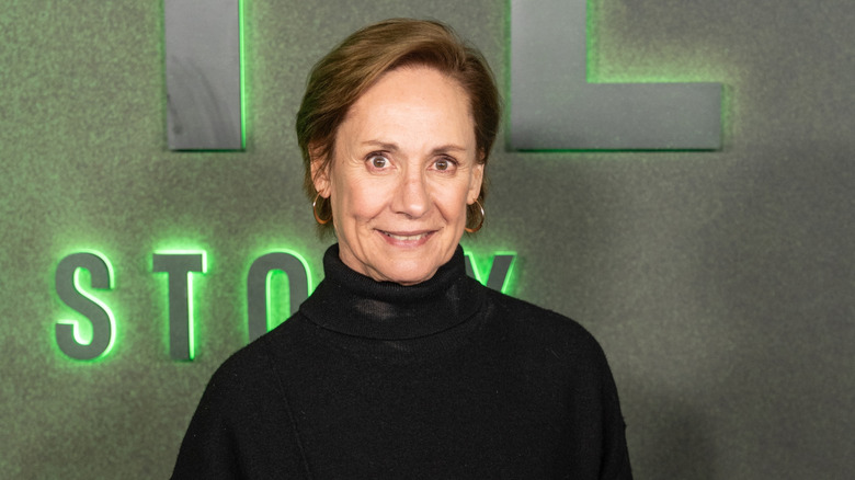 Laurie Metcalf smiles on a red carpet