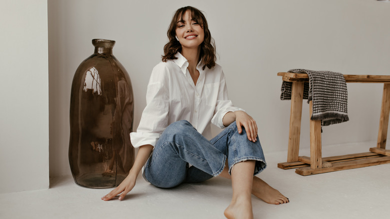 Girl wearing white button up