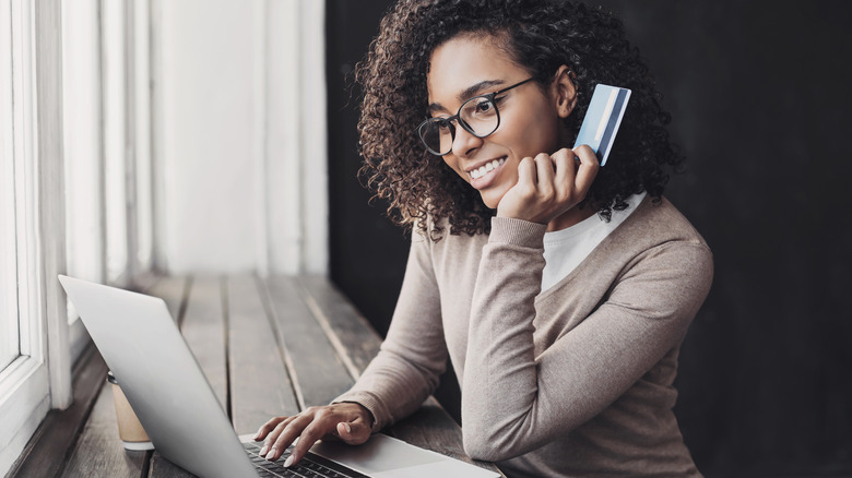 smiling woman online shopping