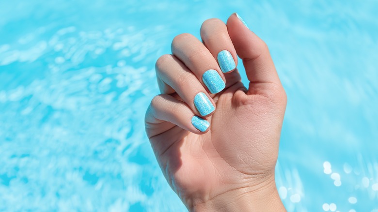 Light blue nails over water