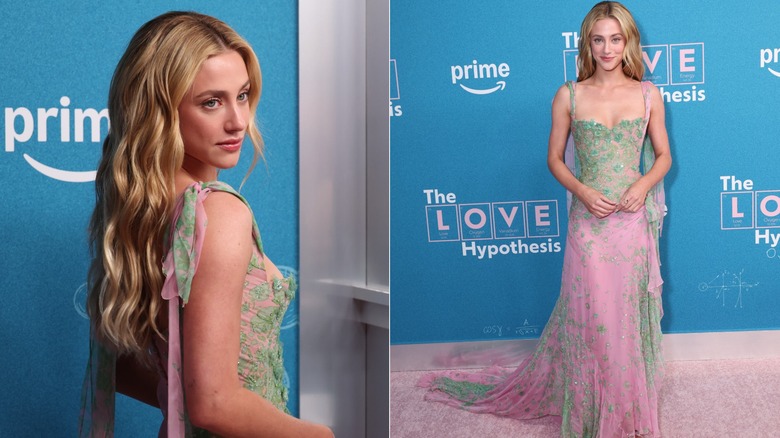 Lili Reinhart posing on a red carpet wearing a pink and green gown