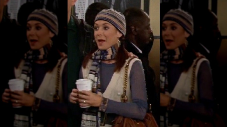 Lily Aldrin wearing a matching striped hat and scarf