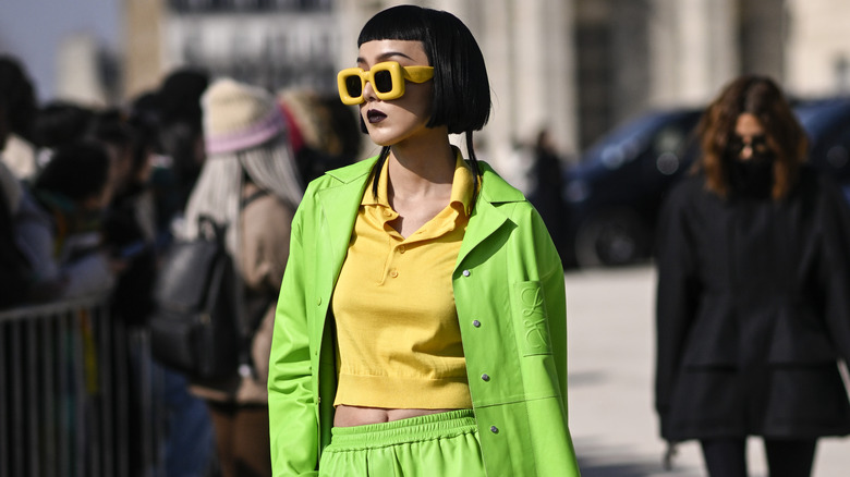 woman wearing lime green jacket and pants