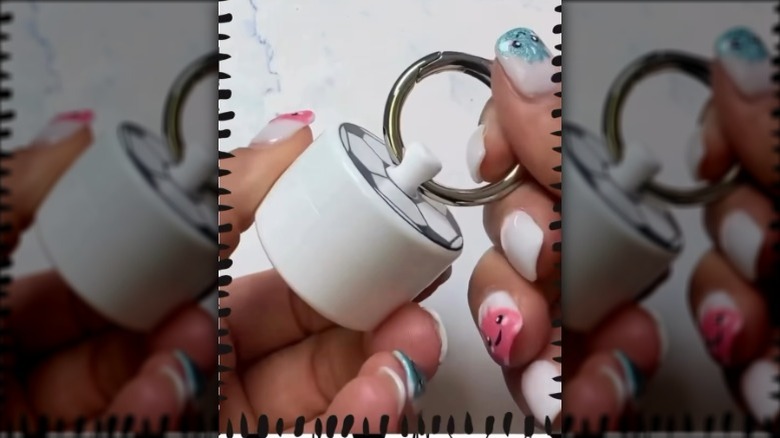 Hands holding a Lion Latch product