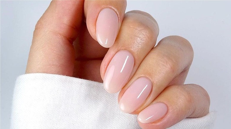Pale pink lip oil nails