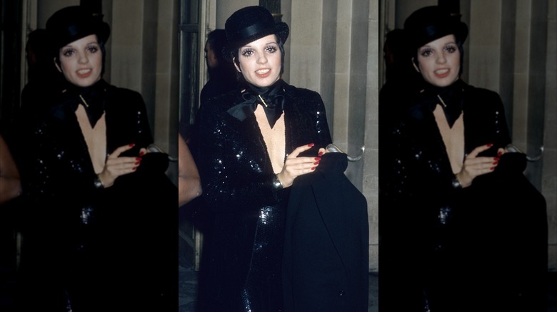 Liza Minnelli wearing a sparkly all-black outfit with a black bowler hat.