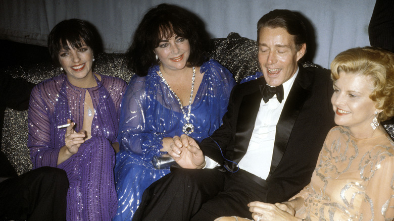 Photo of Elizabeth Taylor, Liza Minnelli, Halston, Betty Ford sitting together at Studio 54 in 1977.