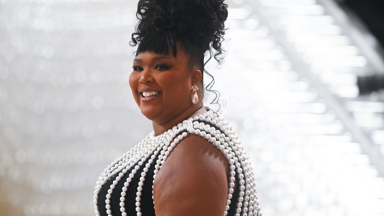 Lizzo smiling at Met Gala