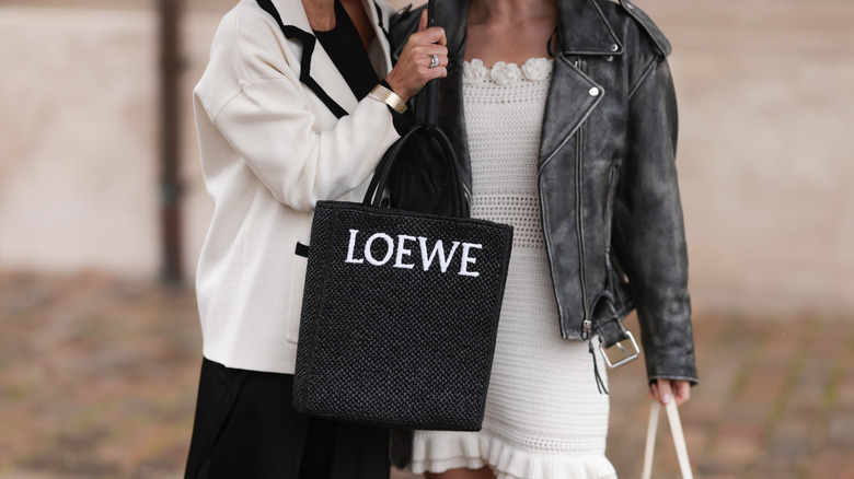 Woman holding Loewe bag