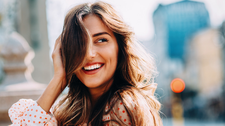 Woman with brunette hair smiling