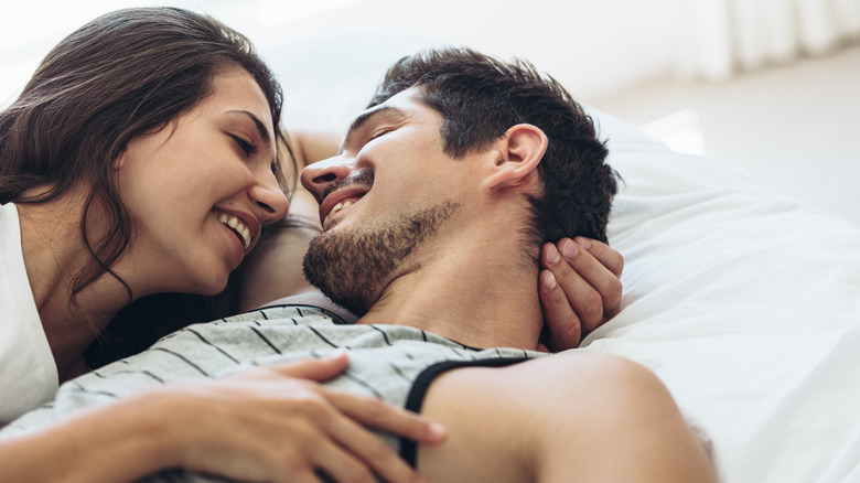 happy couple in bed