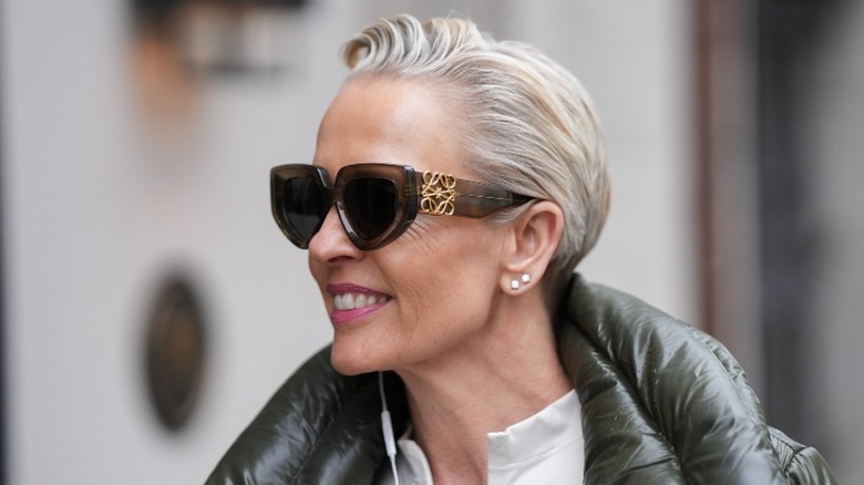 A woman with a swept-back pixie