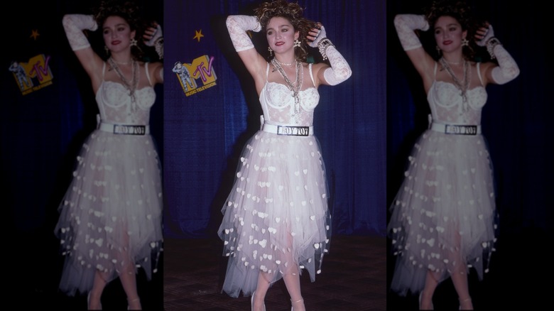 Madonna wears a white lace outfit and "boy toy" belt to the 1984 MTV Video Music Awards