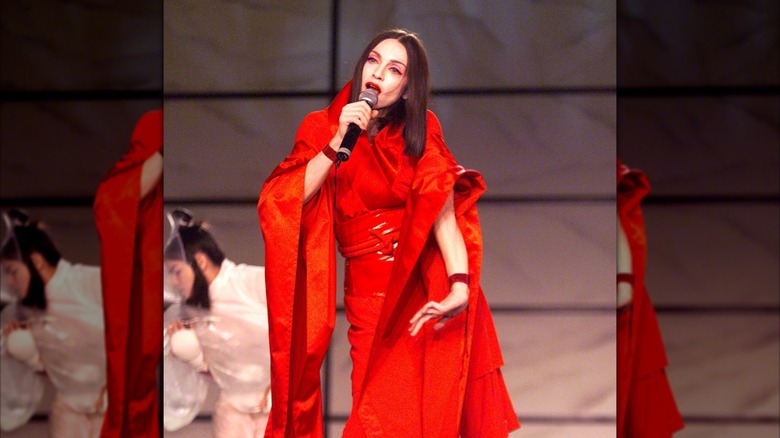 Madonna performs in a red outfit