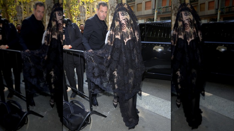 Madonna in 2024 wearing a lacy black weil