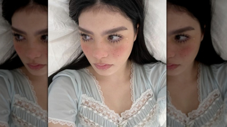 Woman with freckles and spider lashes