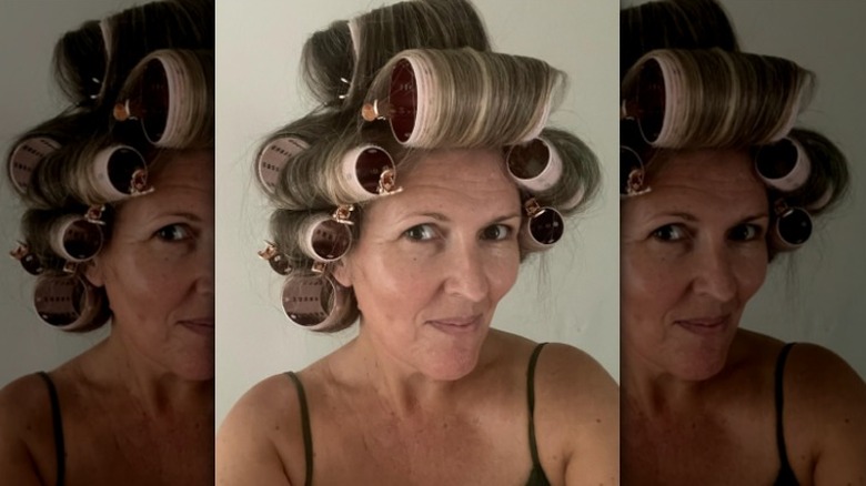 Woman with rollers in hair