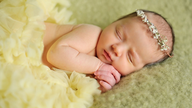 Baby sleeping with a flower crown