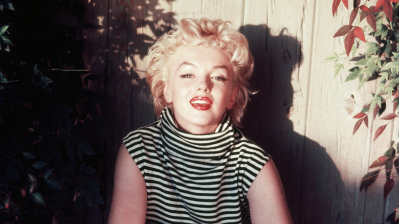 Marilyn Monroe poses on a striped top