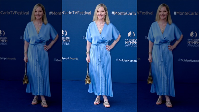 Melissa Sue Anderson smiles wearing a light blue satin maxi dress