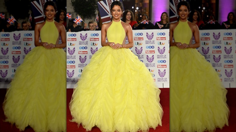 Maura Higgins smiles while wearing a yellow dress at the Pride of Britain Awards in 2022