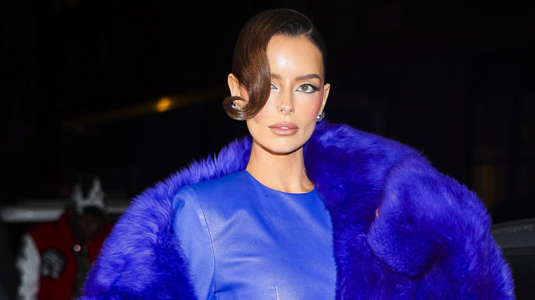 Maura Higgins wears a large blue coat