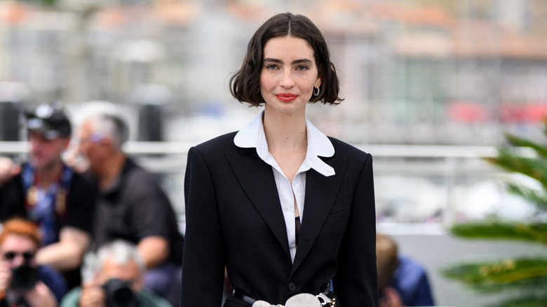 Meadow Walker wearing a blazer and red lipstick